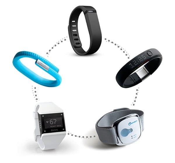 Five wrist and arm fitness trackers arranged in a circle